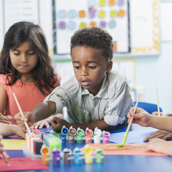 young students painting