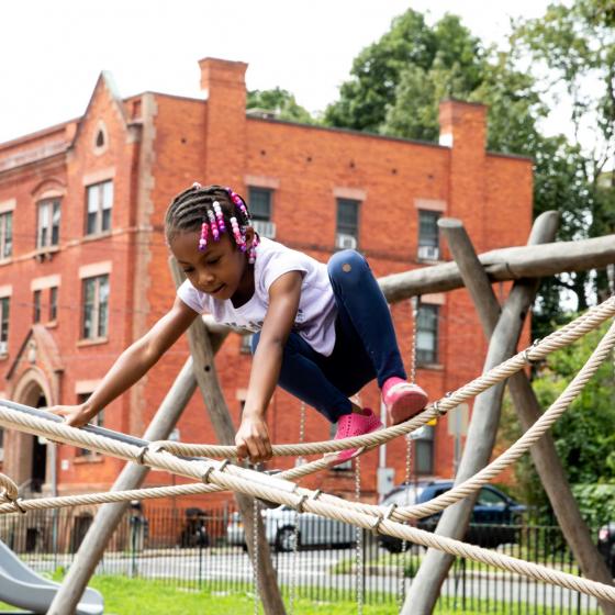 child on playground equipment