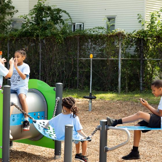 Children playing on playground equipment