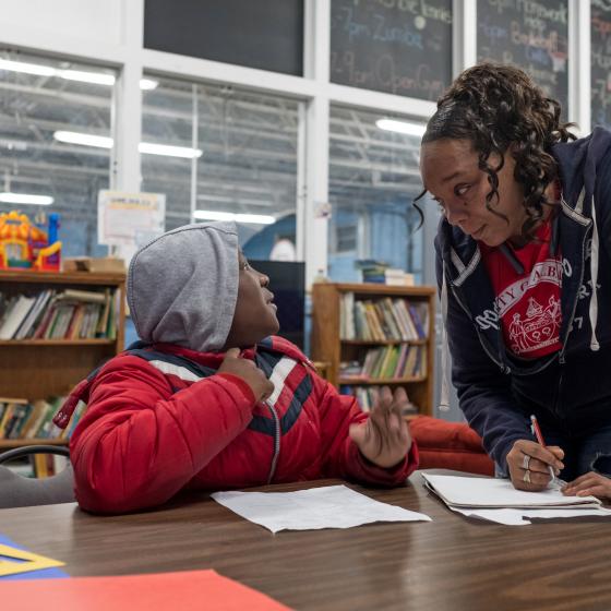 Child and adult at homework center