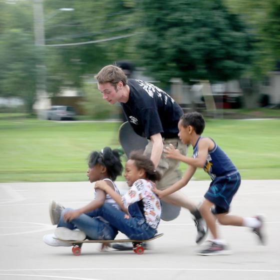 kids on a skateboard in Madison, WI park;